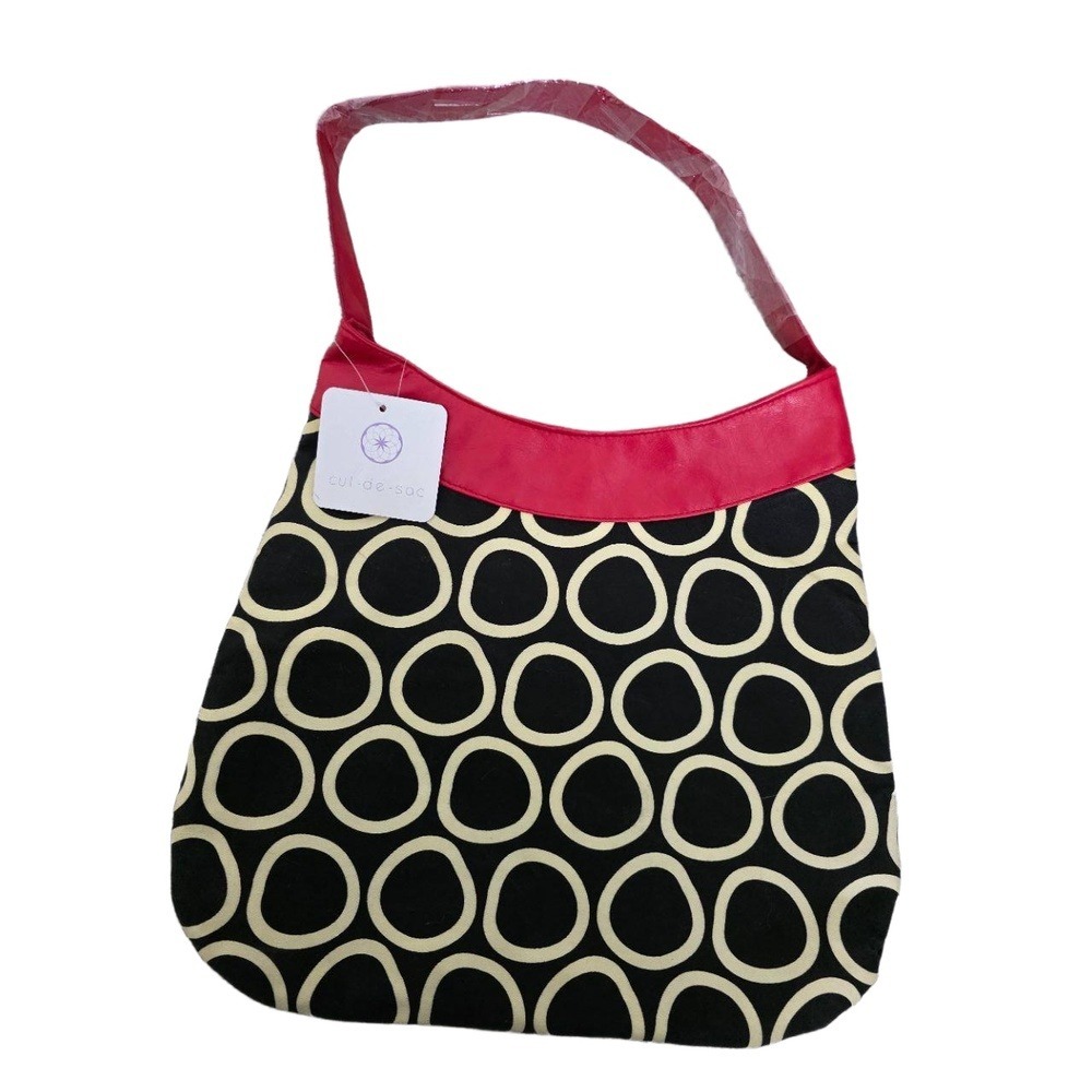 NWT Culdesac black & cream handbag‎ with red strap, zipper pocket & snap closure